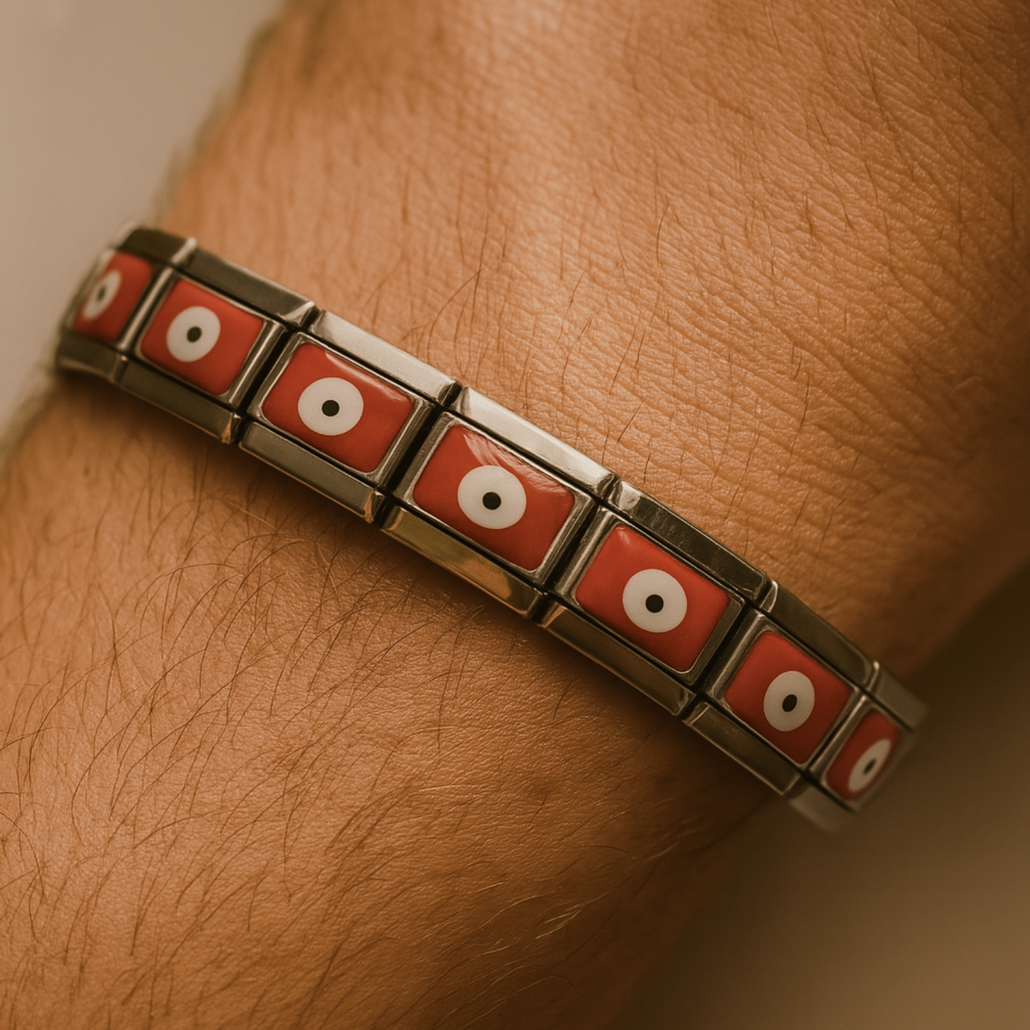 Bracelet with red and silver design on a wrist