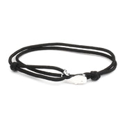 Black bracelet with silver whale charm on adjustable cord