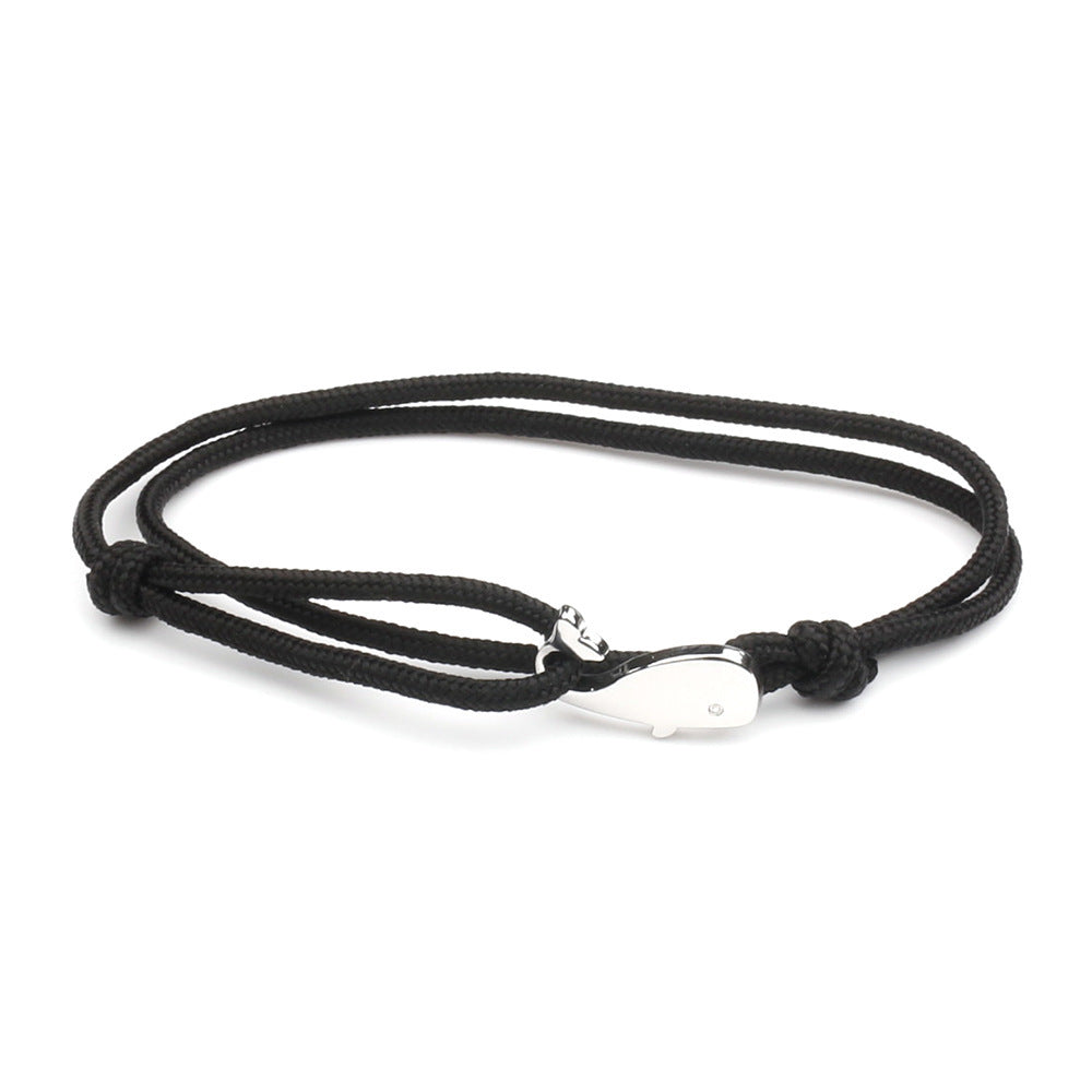 Black bracelet with silver whale charm on adjustable cord