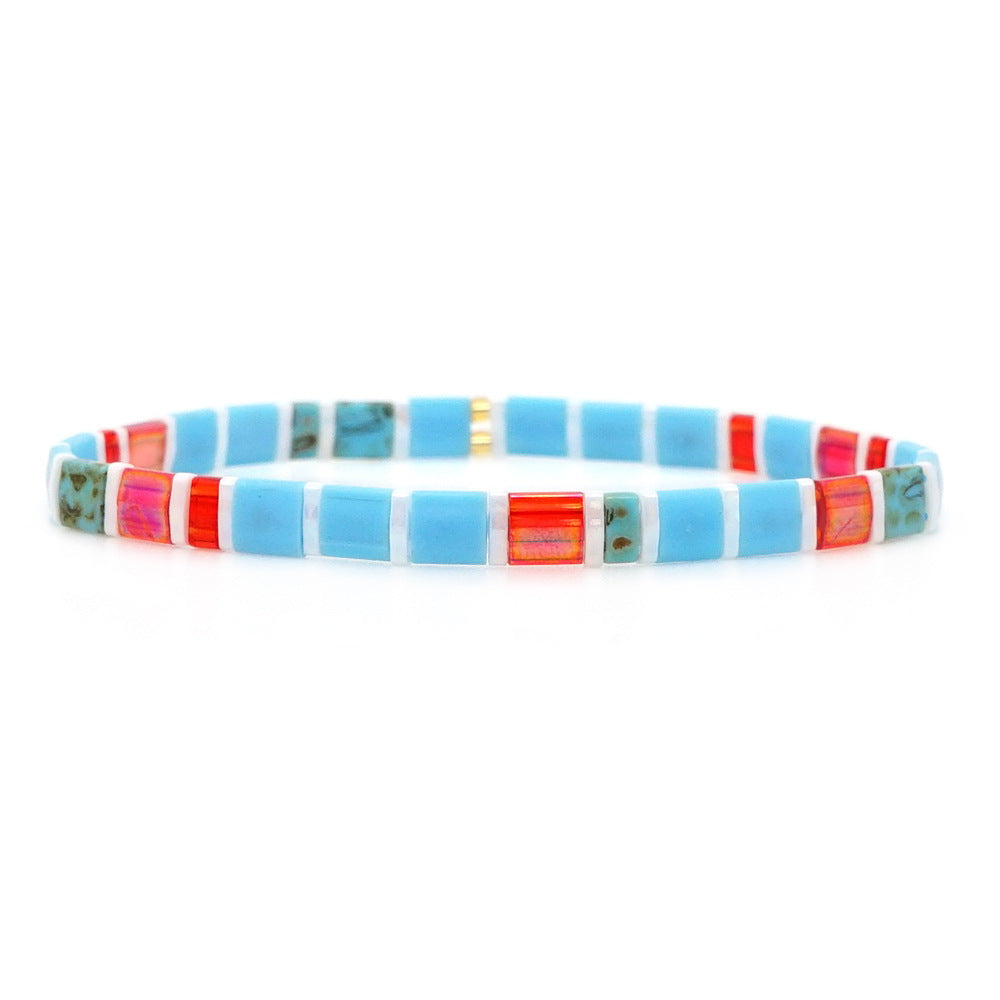 Mosaic-style bracelet with turquoise, red, and green beads inspired by Capri