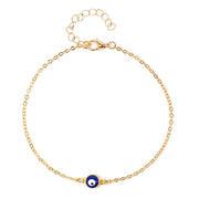 Gold bracelet with a blue evil eye charm on a white background