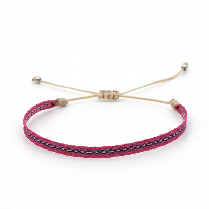 Corsica woven bracelet featuring earthy colors and bohemian design.