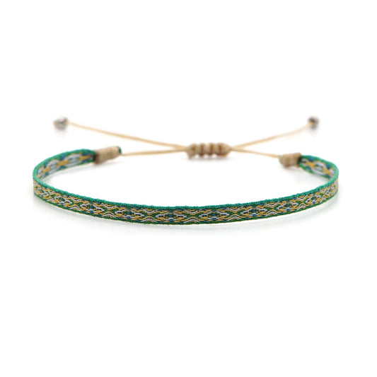 Mykonos woven bracelet featuring blue and white bohemian patterns.