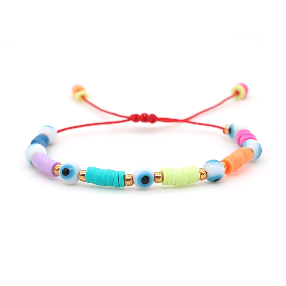 Evil Eye Multicolor Beaded Bracelet on a red string with colorful beads and adjustable fit.