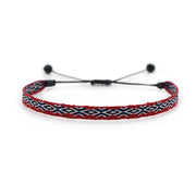 Burgundy woven bracelet with navy and white geometric pattern, featuring adjustable black cord.