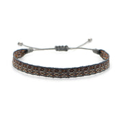 Handwoven bracelet with brown, ivory, and grey thread pattern, displayed on a white background with adjustable grey cord.