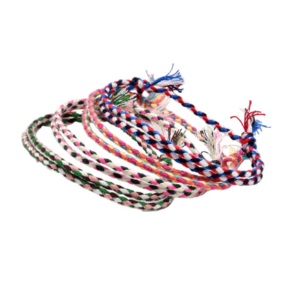 Colorful braided bracelets on a white background