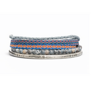Set of three bracelets with patterned bands on a white background