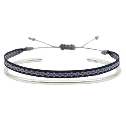 Dark blue and purple woven bracelet with silver accents, paired with a polished silver bangle – a refined and minimalistic bracelet duo.
