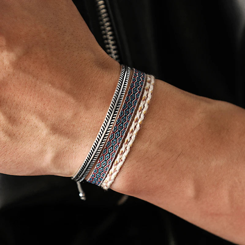 Mediterranean-inspired Capri Layers Bundle Bracelet on a wrist with three elegant designs.