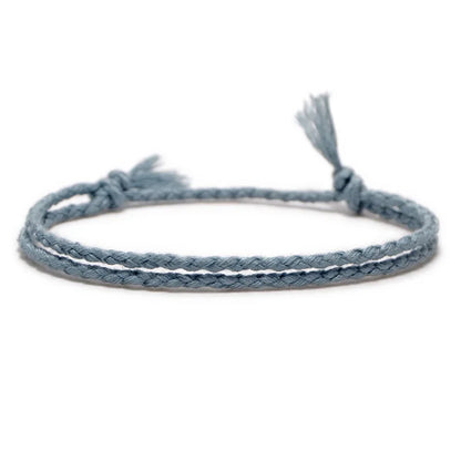 Light grey braided rope bracelet, adding a soft, textured layer to a wrist stack.