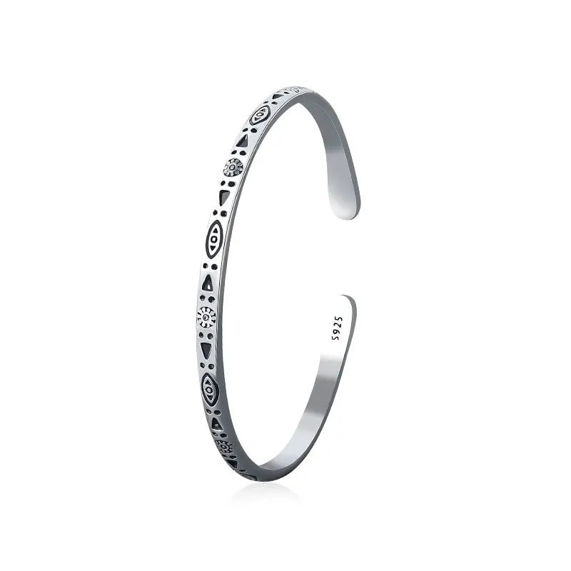 Sterling silver open cuff bangle with engraved protective symbols