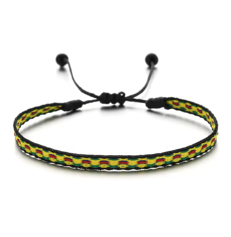 Handmade bracelet with green, red, and yellow weave on black adjustable cord.