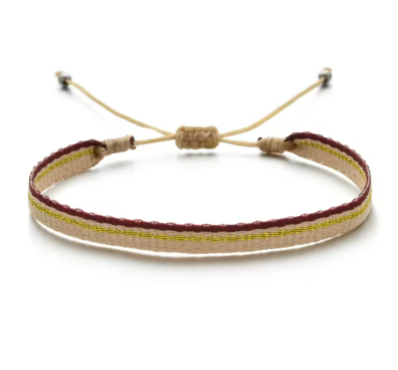 Minimalist handmade bracelet in beige with gold and burgundy trim and adjustable closure.