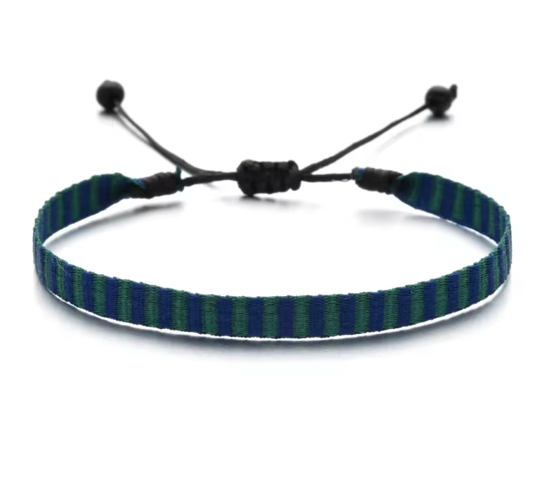 Striped woven bracelet in navy blue and green with black adjustable cord, handmade design.