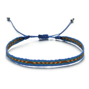 Blue and brown braided bracelet on a white background