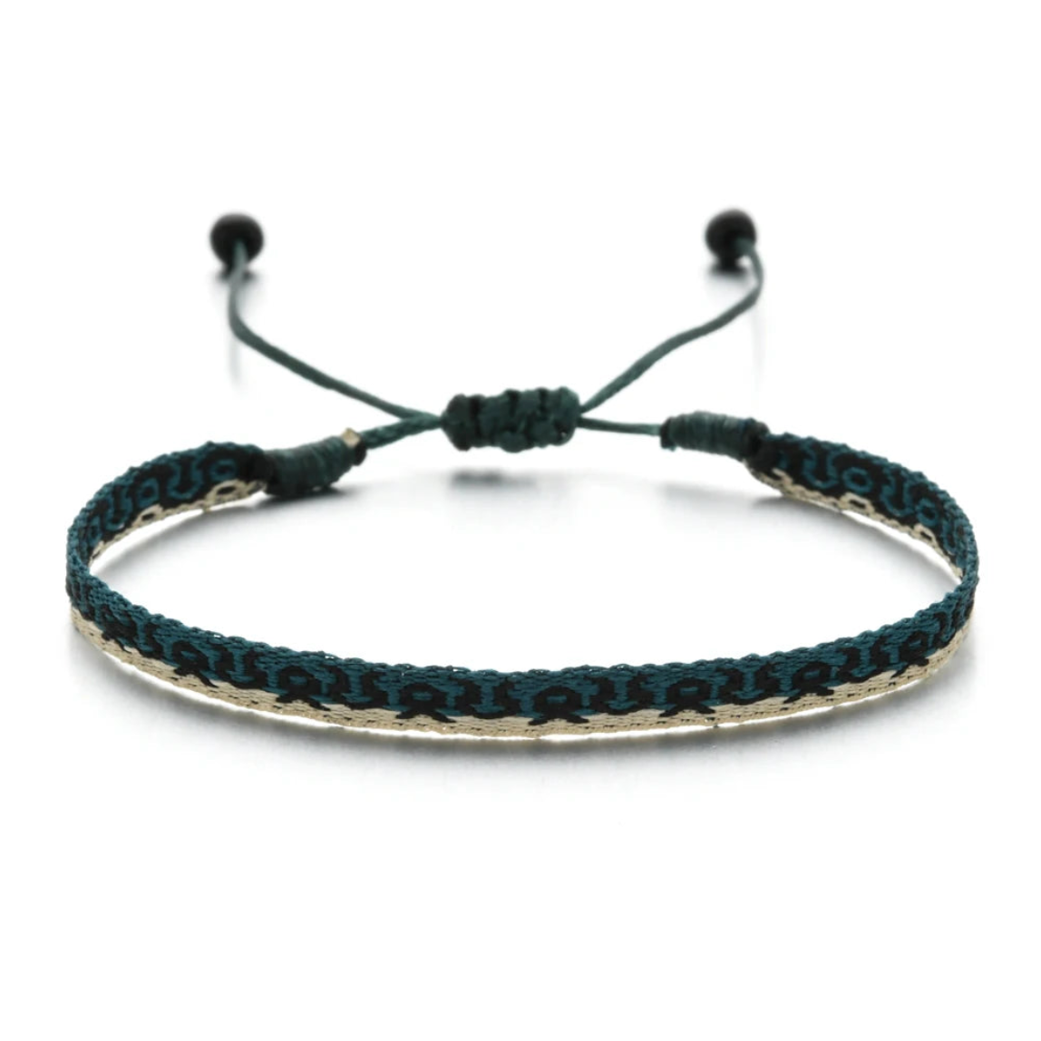 Teal and black woven bracelet with geometric pattern on beige background, adjustable cord design