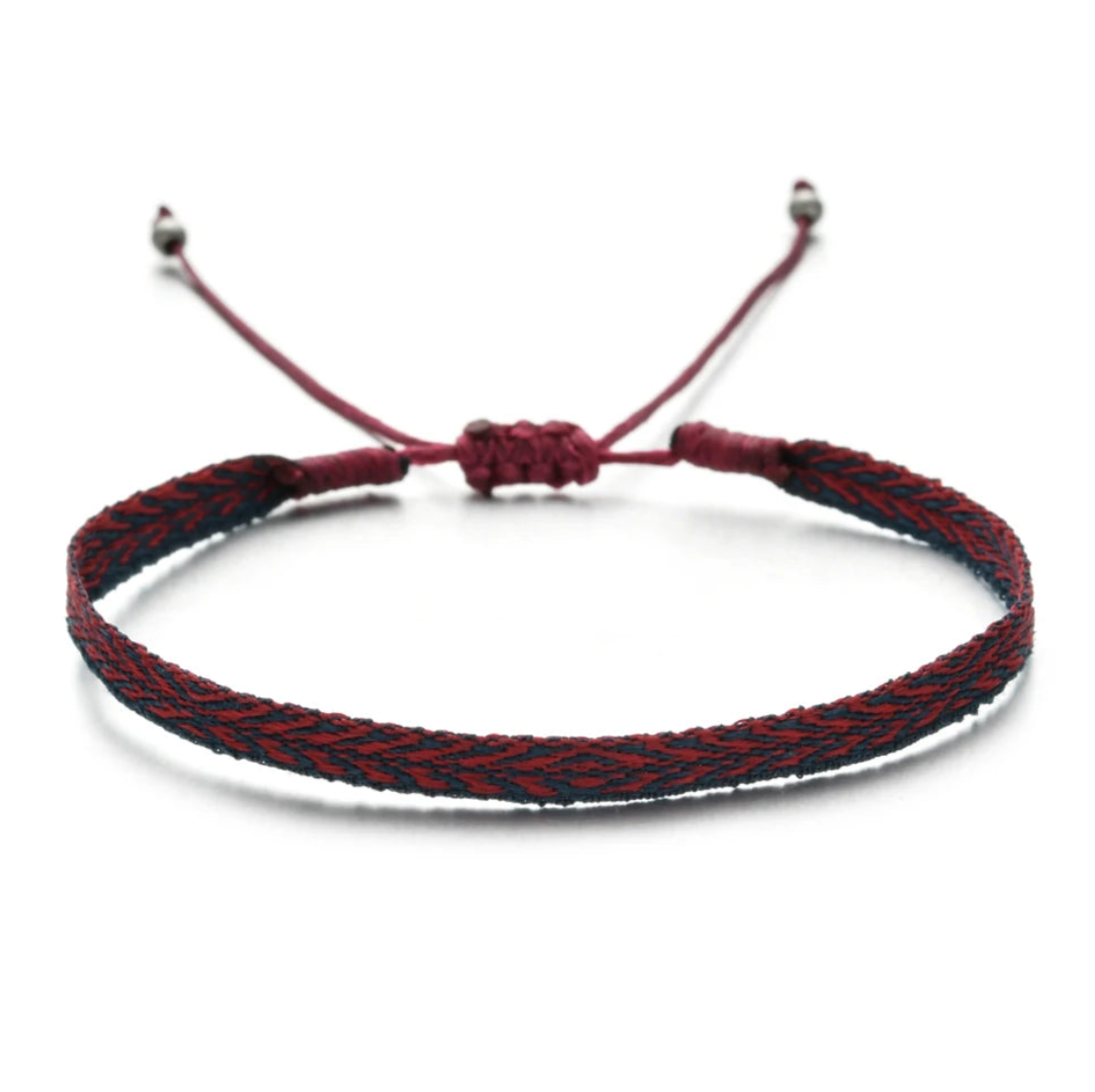 Bracelet with red and black braided cord on a white background