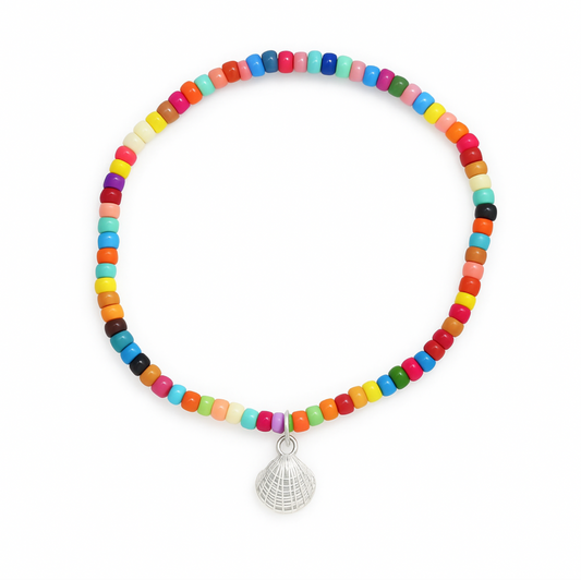 Colorful beaded bracelet with silver shell charm on white background