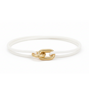 White bracelet with a gold clasp on a white background