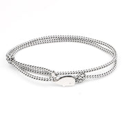 White and black bracelet with silver whale charm