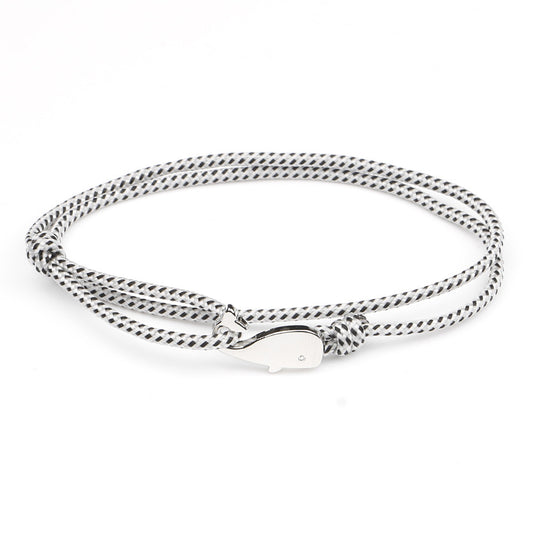 White and black bracelet with silver whale charm