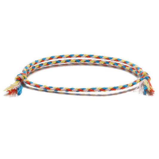 Prosperity bracelet featuring durable string and symbolic Tibetan-inspired design.