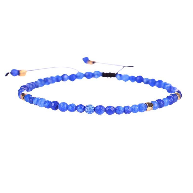 Blue beaded bracelet with gold accents, handmade in European-inspired design