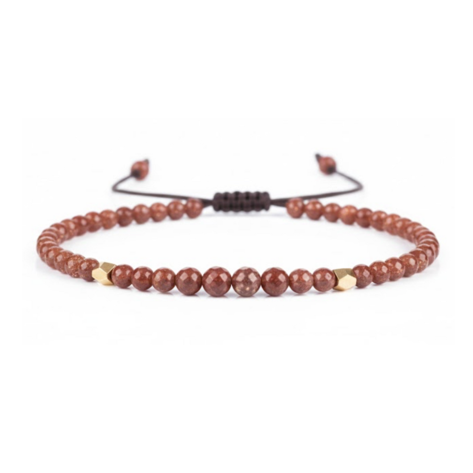 Beaded bracelet with brown and gold beads on a white background