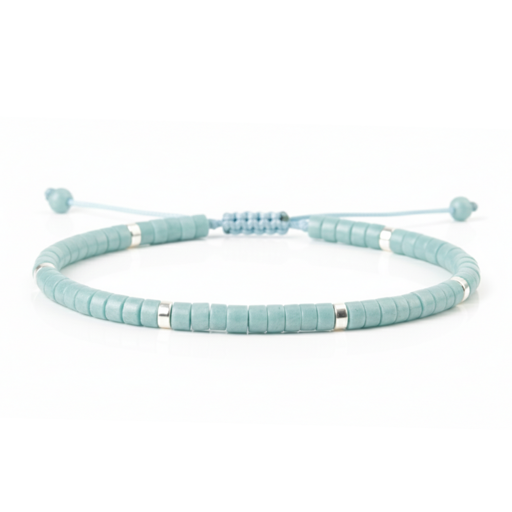 Light blue beaded bracelet on a white background