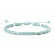 Light blue beaded bracelet on a white background