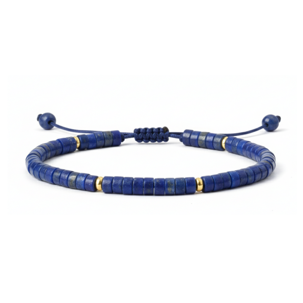 Blue beaded bracelet with gold accents on a white background